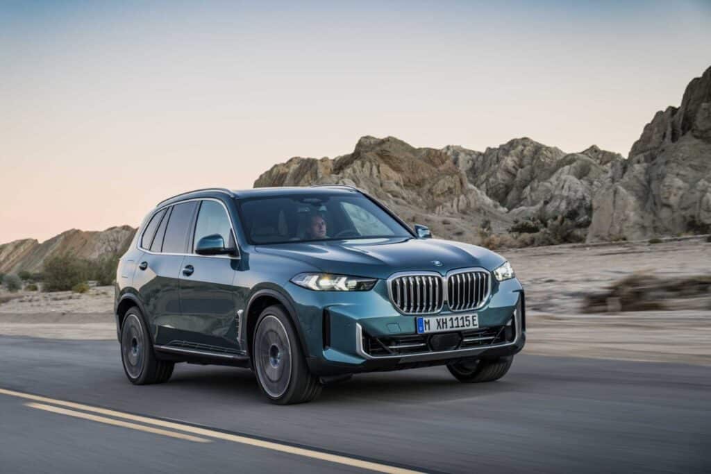 BMW X5 driving on a mountain road