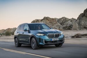 BMW X5 driving on a mountain road
