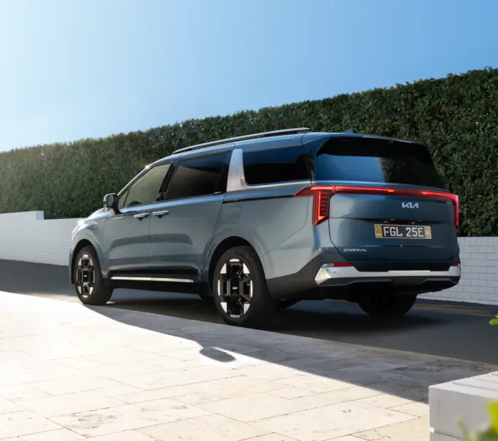 Kia Carnival people mover, rear three-quarter view